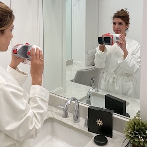 smile express results instagram - woman taking photo of herself in the mirror